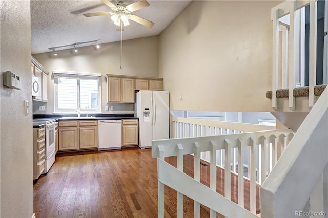 kitchen featuring a textured ceiling, dark hardwood / wood-style flooring, light brown cabinets, white appliances, and ceiling fan