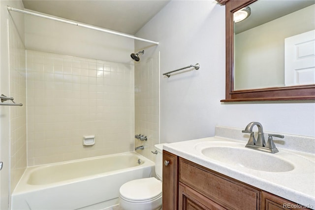 full bathroom with toilet, tiled shower / bath combo, and vanity