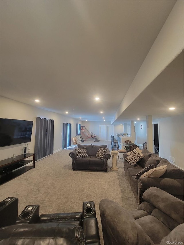 living area with recessed lighting, carpet flooring, and visible vents