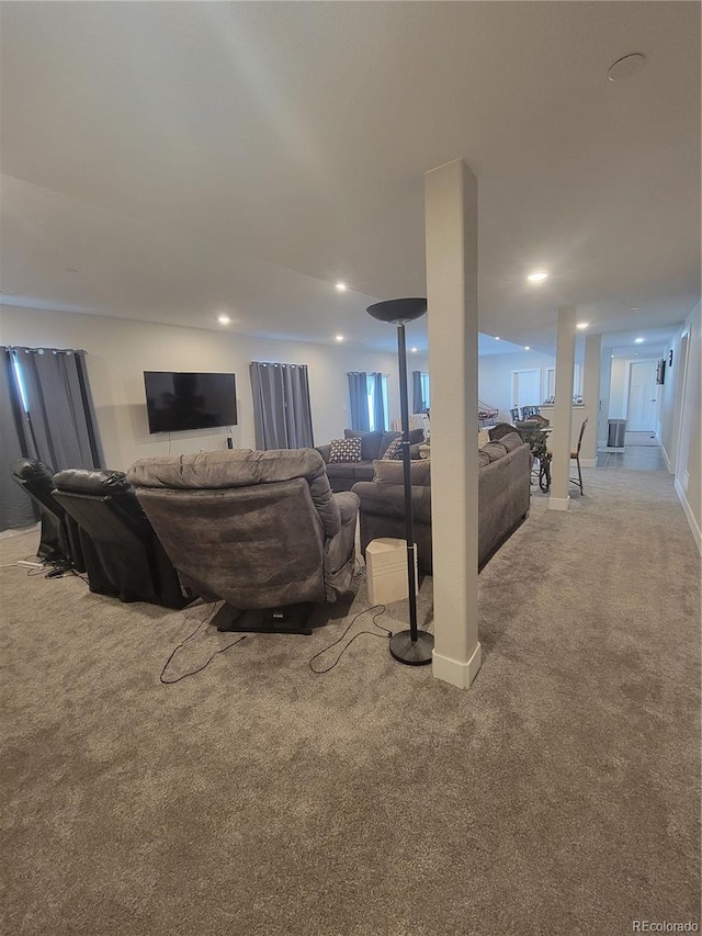 living area with light carpet, baseboards, and recessed lighting