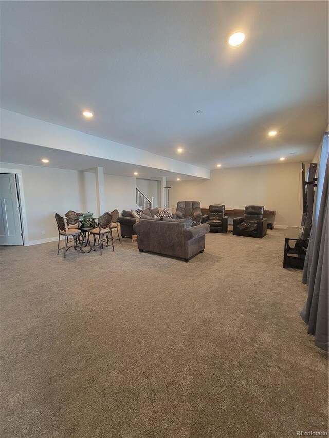 carpeted living room featuring stairway, recessed lighting, and baseboards