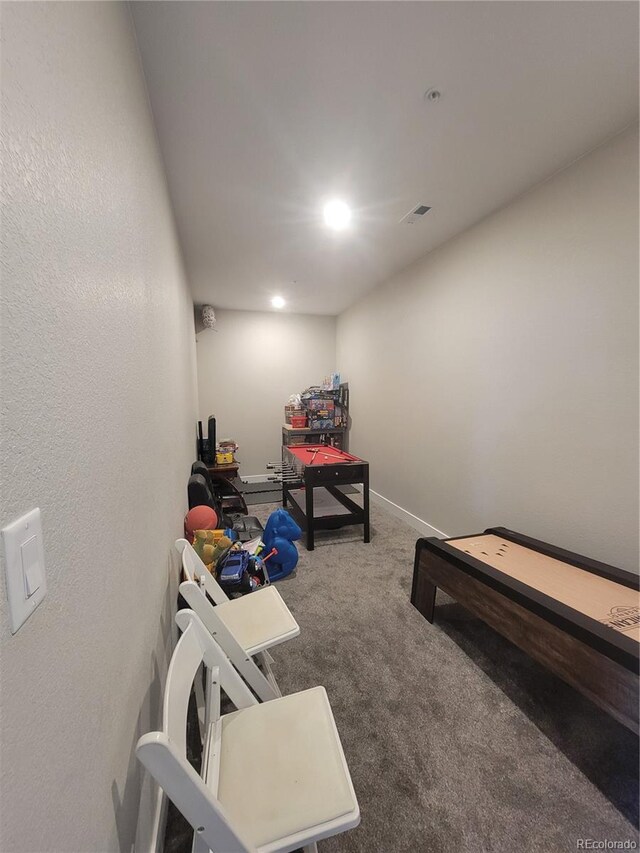 rec room featuring carpet floors, visible vents, and baseboards