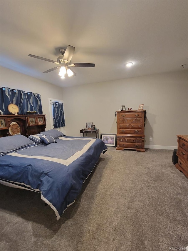 bedroom with ceiling fan, carpet floors, and baseboards