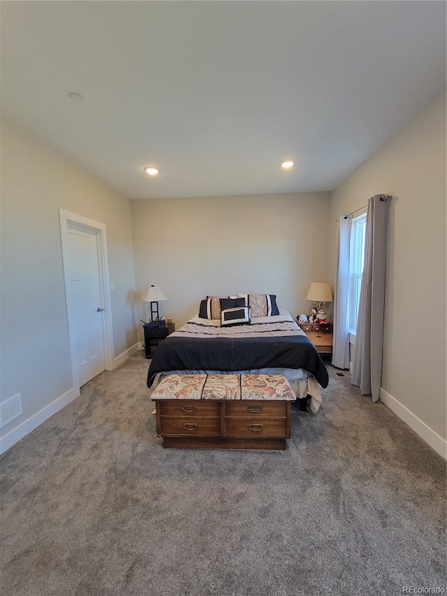 carpeted bedroom with recessed lighting, visible vents, and baseboards