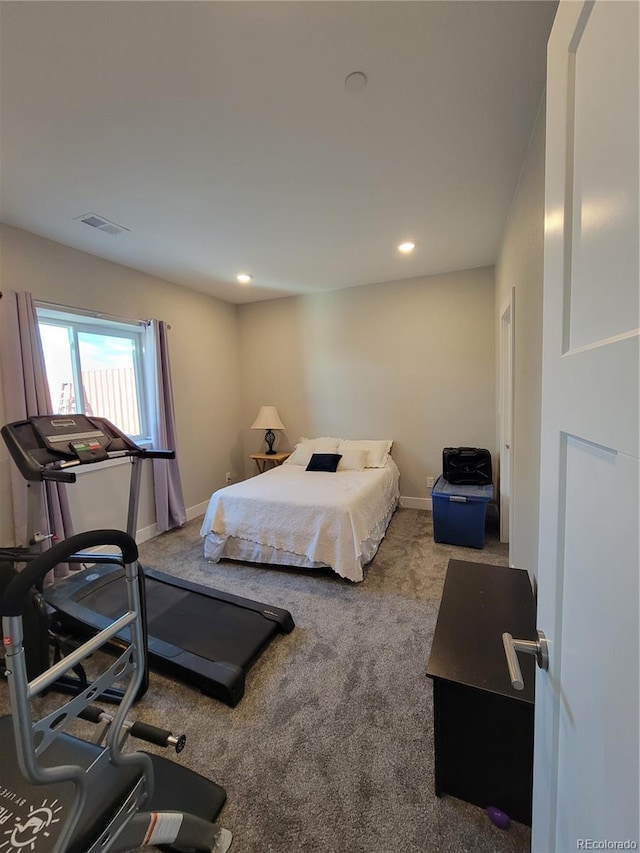 bedroom with carpet, visible vents, and baseboards