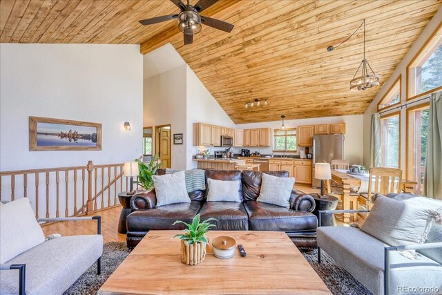 1387 Bobcat Ln, Fairplay, CO 80440 - living area featuring wood ceiling, high vaulted ceiling, light wood finished floors, and a ceiling fan