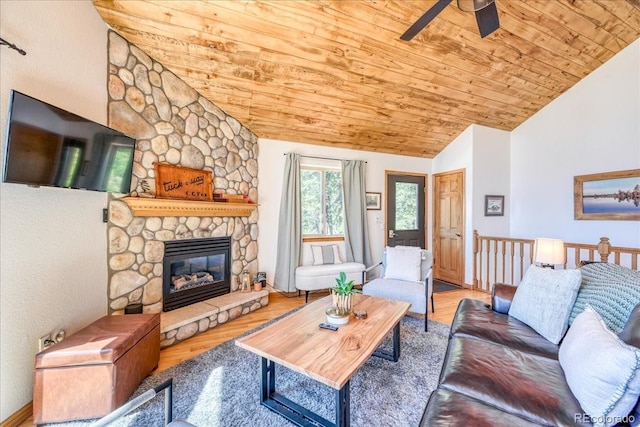 1387 Bobcat Ln, Fairplay, CO 80440 - living room with wood ceiling, lofted ceiling, ceiling fan, a fireplace, and wood finished floors