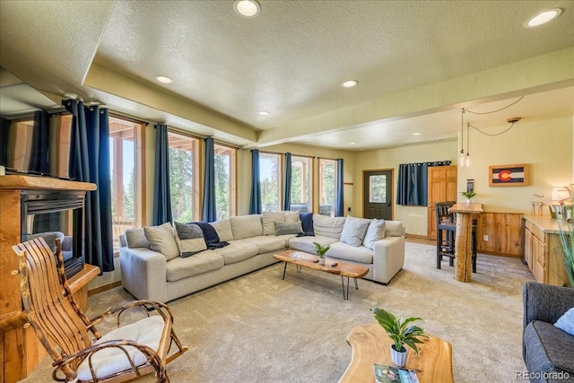 1387 Bobcat Ln, Fairplay, CO 80440 - living area featuring light colored carpet, plenty of natural light, recessed lighting, a textured ceiling, and a glass covered fireplace