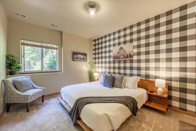 1387 Bobcat Ln, Fairplay, CO 80440 - carpeted bedroom featuring wallpapered walls and baseboards