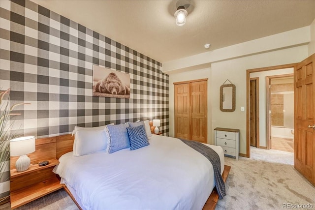 1387 Bobcat Ln, Fairplay, CO 80440 - bedroom featuring wallpapered walls, a closet, and light carpet
