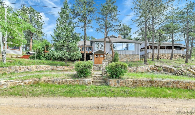 350 Tower Hill Cir, Golden, CO 80401 - view of front of property with stone siding and board and batten siding