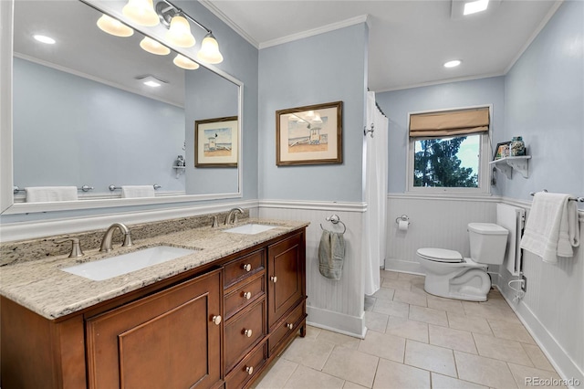 350 Tower Hill Cir, Golden, CO 80401 - bathroom with double vanity, tile patterned floors, a wainscoted wall, and ornamental molding