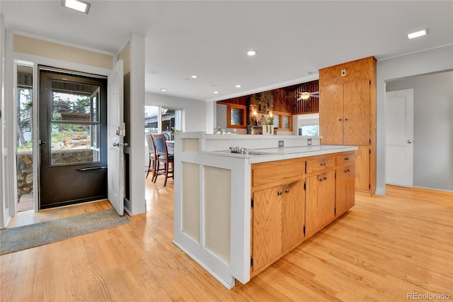 350 Tower Hill Cir, Golden, CO 80401 - kitchen featuring light wood finished floors, light countertops, and recessed lighting