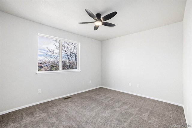 unfurnished room featuring carpet and ceiling fan