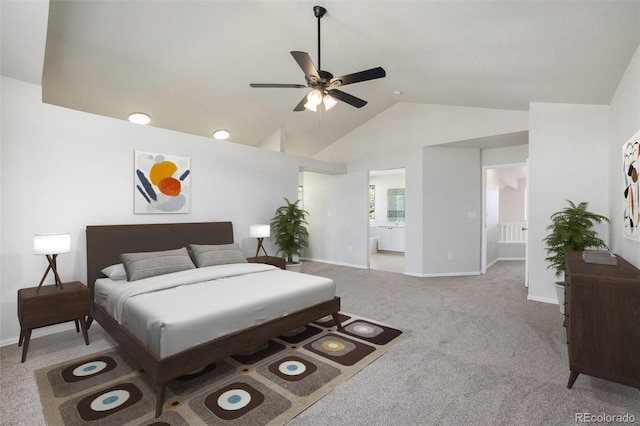 carpeted bedroom featuring connected bathroom, ceiling fan, and lofted ceiling