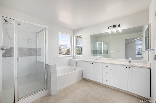 bathroom featuring vanity and shower with separate bathtub