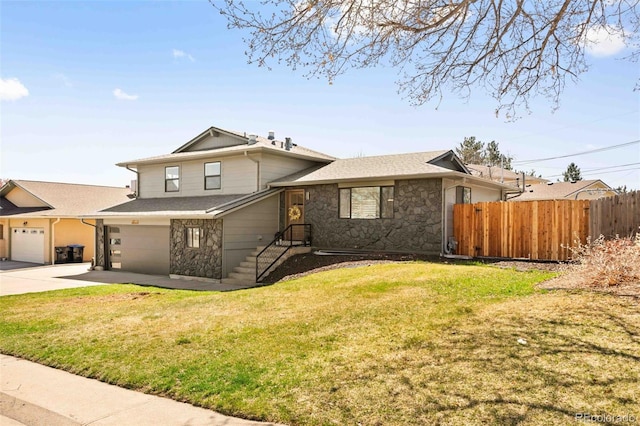 6844 W 69th Pl, Arvada, CO 80003 - split level home featuring stone siding, driveway, and an attached garage