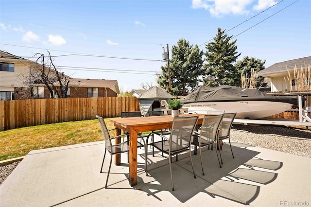 6844 W 69th Pl, Arvada, CO 80003 - view of patio / terrace featuring outdoor dining space and an outbuilding