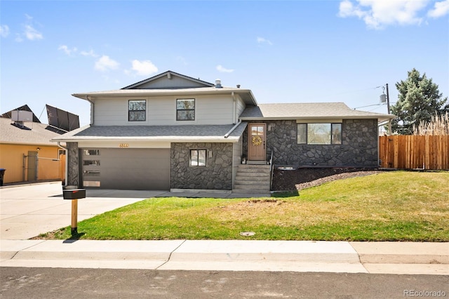 6844 W 69th Pl, Arvada, CO 80003 - tri-level home featuring stone siding, driveway, an attached garage, and a shingled roof
