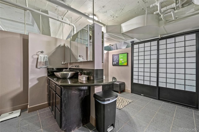 kitchen featuring tile patterned flooring and sink