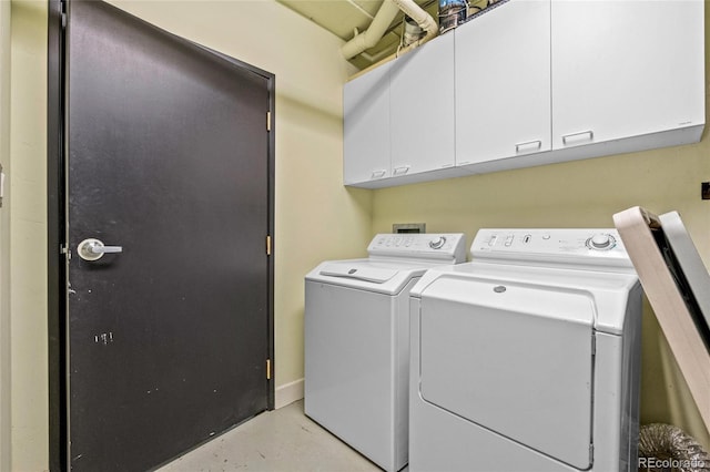 laundry area featuring cabinets and washer and dryer