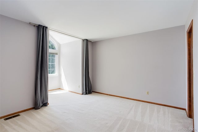 3951 S Carson St Unit D, Aurora, CO 80014 - spare room featuring light colored carpet and baseboards