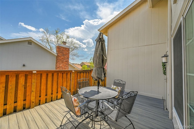 7077 S Knolls Way, Centennial, CO 80122 - wooden terrace featuring outdoor dining area
