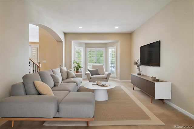 living room featuring light carpet