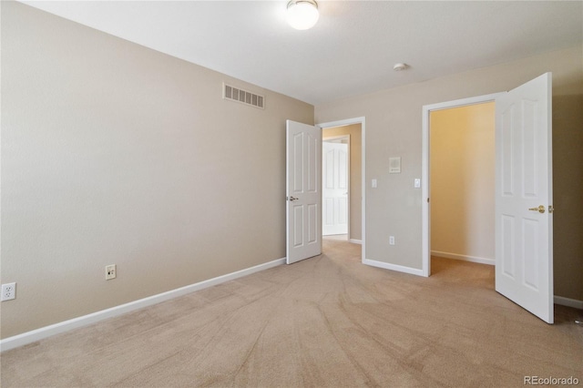 unfurnished bedroom with light carpet