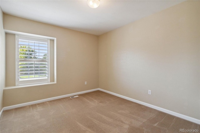 empty room with carpet flooring