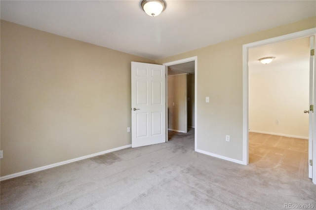 unfurnished bedroom with light carpet