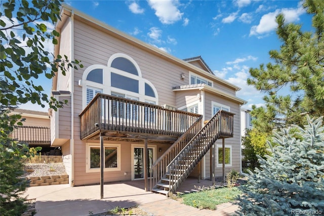 rear view of property with a deck