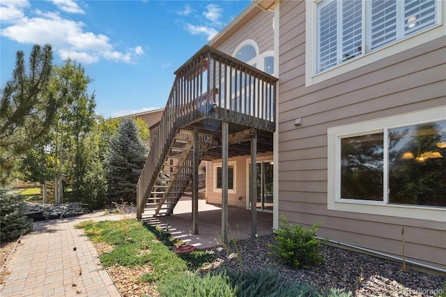 exterior space with a patio and a deck