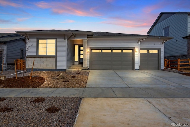 24741 E 33rd Dr, Aurora, CO 80019 - view of front of house with a garage and driveway