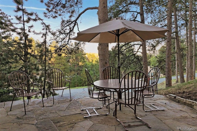 view of patio terrace at dusk