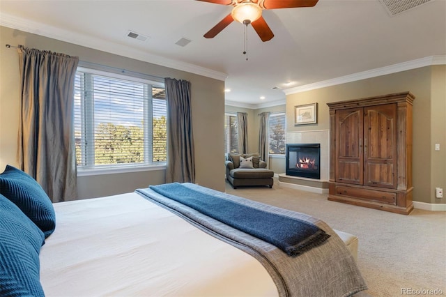 bedroom with ceiling fan, carpet floors, and ornamental molding