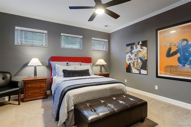 carpeted bedroom featuring ceiling fan and crown molding