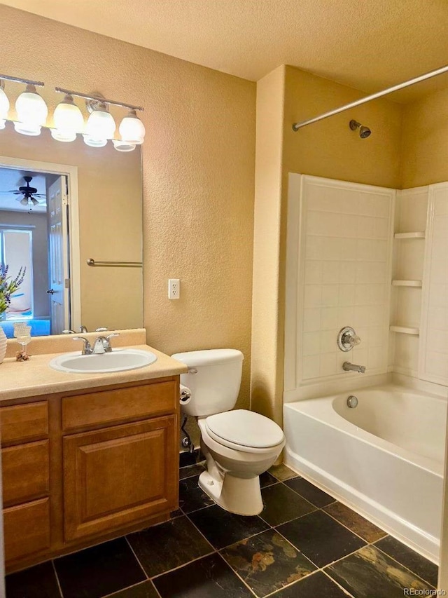 bathroom with a textured wall, toilet, shower / bathtub combination, a textured ceiling, and vanity