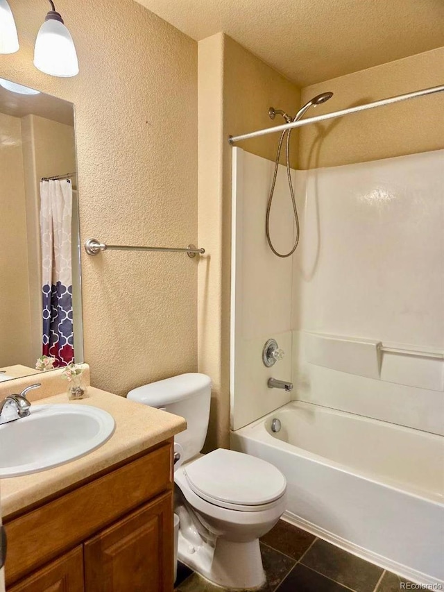 bathroom featuring toilet, tile patterned flooring, shower / bath combo with shower curtain, a textured ceiling, and vanity