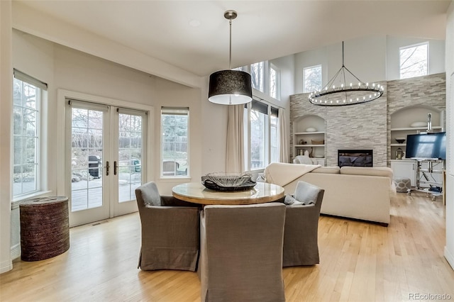 2464 Ginny Way, Lafayette, CO 80026 - dining area with light wood finished floors, healthy amount of natural light, french doors, and built in features