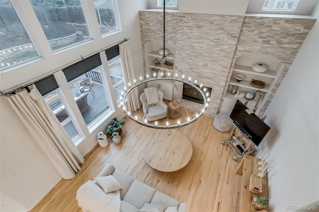 2464 Ginny Way, Lafayette, CO 80026 - living room with a chandelier, wood finished floors, and a high ceiling