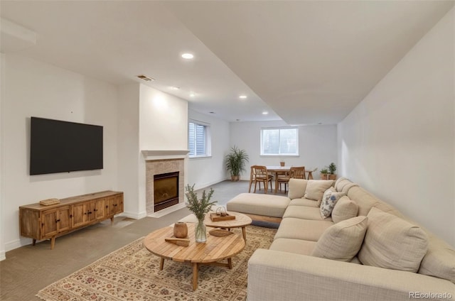2464 Ginny Way, Lafayette, CO 80026 - living room with light colored carpet, recessed lighting, a tile fireplace, and baseboards