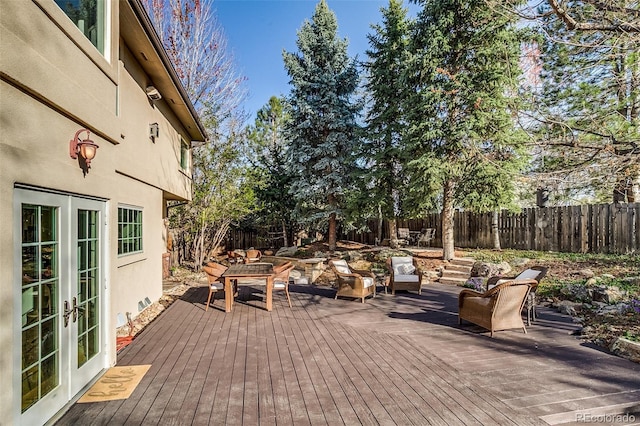 2464 Ginny Way, Lafayette, CO 80026 - wooden deck featuring french doors and a fenced backyard