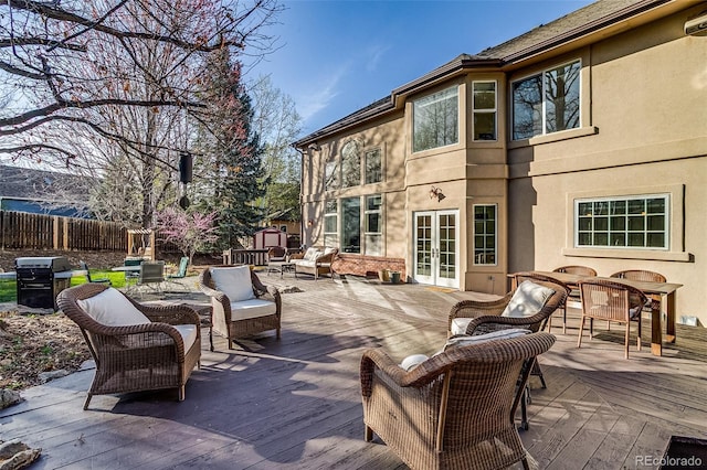 2464 Ginny Way, Lafayette, CO 80026 - wooden deck with french doors, area for grilling, and outdoor lounge area