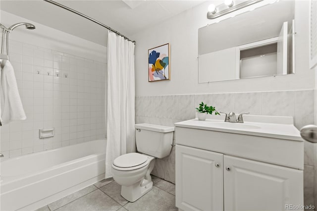 full bathroom with tile walls, vanity, toilet, shower / bath combo, and tile patterned floors