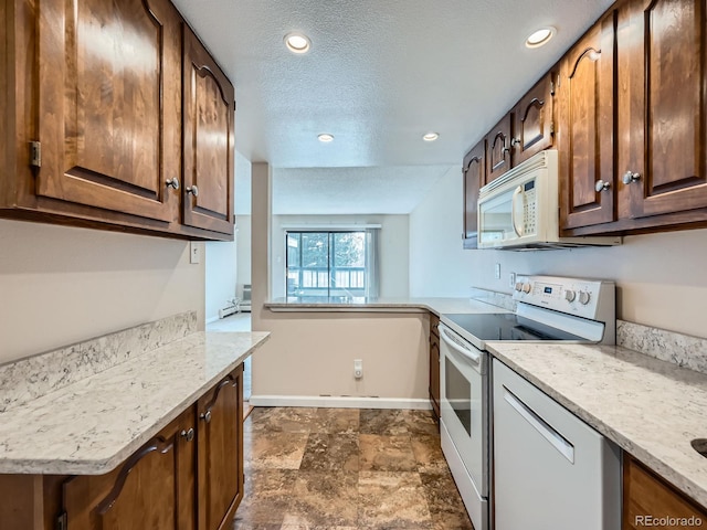 kitchen featuring a textured ceiling, kitchen peninsula, light stone counters, and white appliances