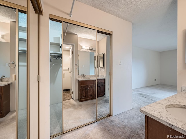 bathroom featuring vanity and a textured ceiling