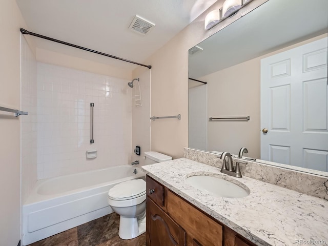 full bathroom with vanity, toilet, and tiled shower / bath combo