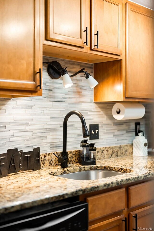 7780 W 38th Ave Unit 203, Wheat Ridge, CO 80033 - kitchen with a sink, decorative backsplash, dishwasher, and light stone counters