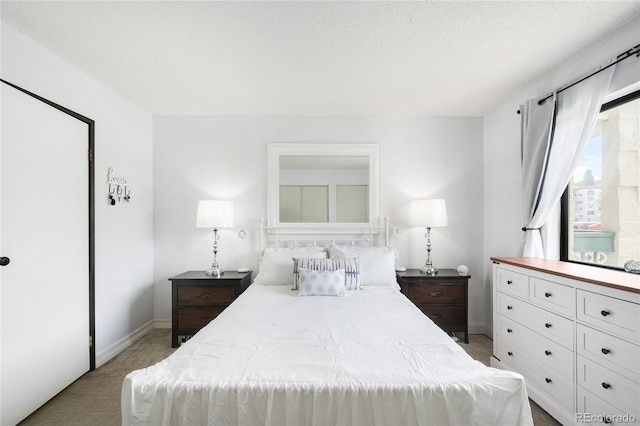 7780 W 38th Ave Unit 203, Wheat Ridge, CO 80033 - bedroom with light colored carpet and baseboards